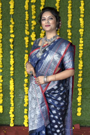 Navy blue color soft lichi silk saree with silver zari weaving work