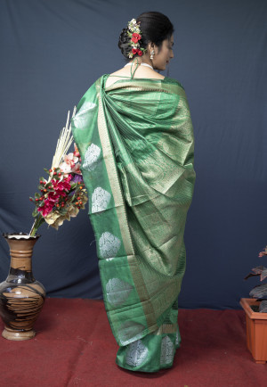 Green color soft linen saree with golden and silver zari woven work
