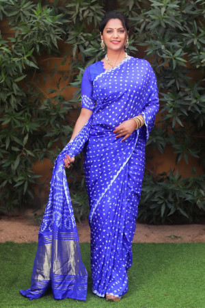 Royal blue color pure bandhej silk saree with zari weaving work