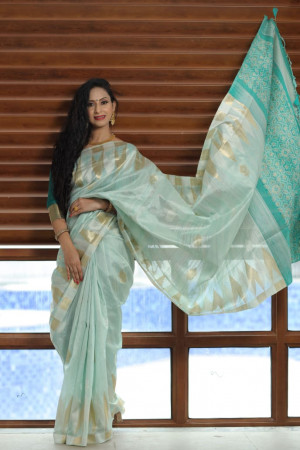 Sea green color tussar silk weaving saree with temple woven border