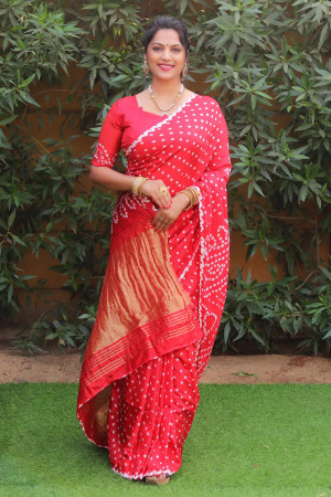 Red color pure bandhej silk saree with zari weaving work