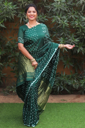 Green color pure bandhej silk saree with zari weaving work