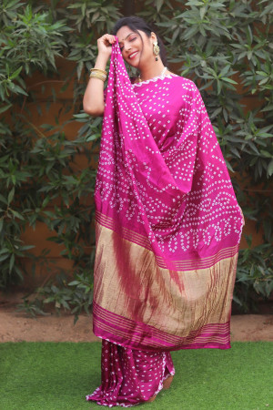 Pink color pure bandhej silk saree with zari weaving work
