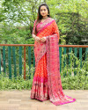 Orange and rani pink color hand bandhej silk saree with zari weaving work