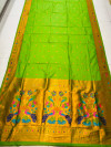 Olive dark green color paithani silk saree with zari weaving work