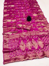 Rani pink color bandhej silk saree with zari weaving work