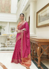 Rani pink color patola silk saree with woven design