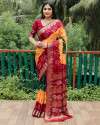 Orange and red color bandhej silk saree with zari weaving work