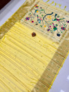 Lemon yellow color paithani silk saree with zari weaving work