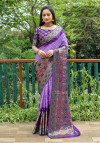 Lavender and purple color hand bandhej silk saree with zari weaving work