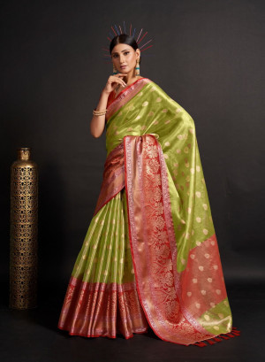 Green and red color organza silk saree with woven design