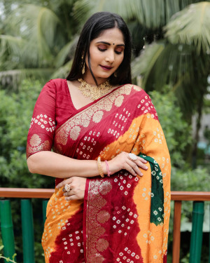 Orange and red color bandhej silk saree with zari weaving work