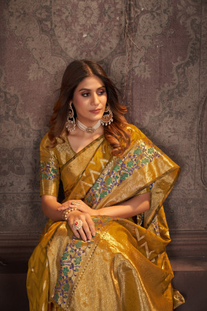 Mustard yellow color banarasi silk saree with zari weaving work