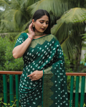 Green color hand bandhej silk saree with zari weaving work