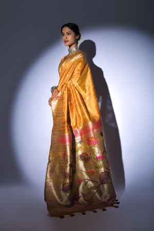 Mustard yellow color tussar silk saree with zari weaving work
