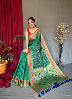 Water green color patola silk saree with woven design