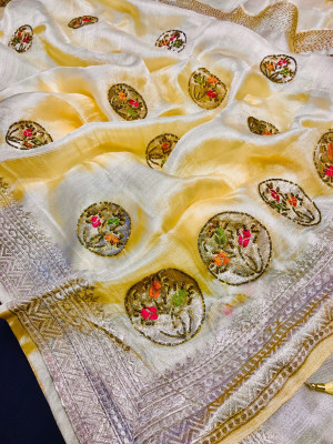 Light yellow color organza silk saree with moti work