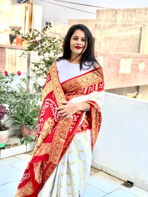 White and red color bandhej silk saree with zari weaving work