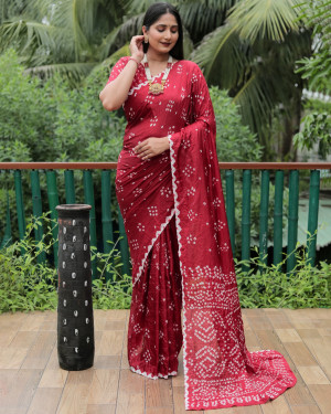 Maroon color bandhej silk saree with printed work