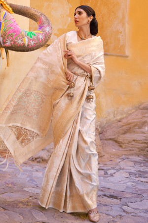 Off white color banarasi silk saree with zari weaving work