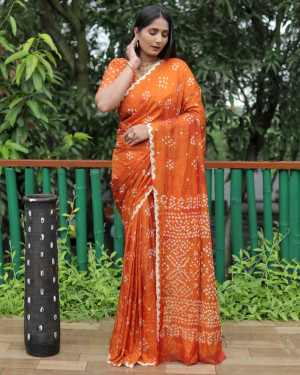 Orange color bandhej silk saree with printed work