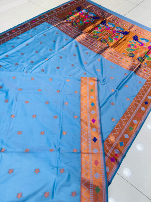 Powder blue color paithani silk saree with zari weaving work
