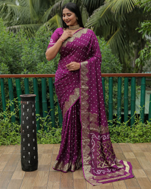 Magenta color hand bandhej silk saree with zari weaving work