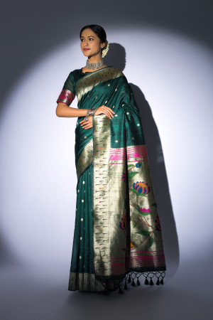Bottle green color tussar silk saree with zari weaving work