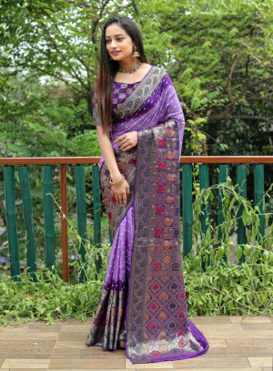 Lavender and purple color hand bandhej silk saree with zari weaving work