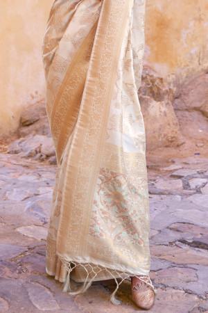 Off white color banarasi silk saree with zari weaving work