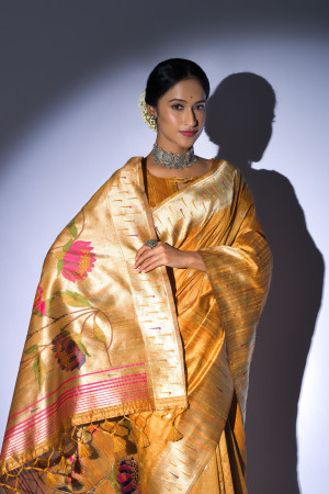 Mustard yellow color tussar silk saree with zari weaving work