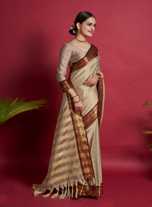 Beige color cotton silk saree with zari weaving work