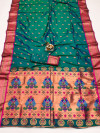 Dark rama green color paithani silk saree with zari weaving work