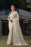 Off white color soft modal silk saree with woven design