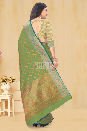 Green color soft banarasi silk saree with zari weaving work