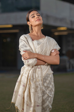 Off white color soft modal silk saree with woven design