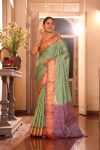 Pista green traditional banarasi silk saree with patola weaving work