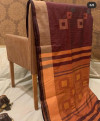 Maroon color soft raw silk saree with geometric woven pallu