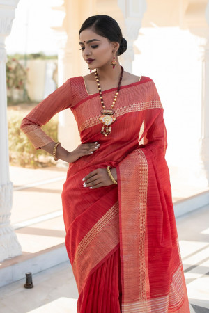 Red color tassar silk saree with zari woven work