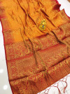 Orange color muslin silk saree with zari woven work