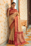 Beige color soft tussar silk saree with zari woven work