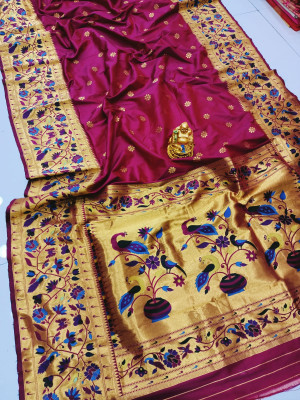 Magenta color paithani silk saree with golde zari weaving work