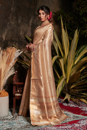Beige color metallic linen saree with zari work