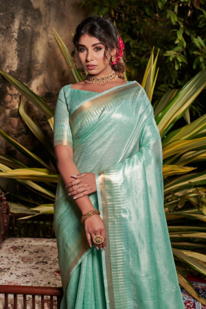 Sea green color metallic linen saree with zari work
