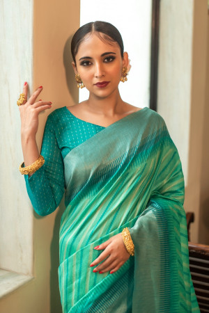 Sea green color soft tussar silk saree with zari woven work