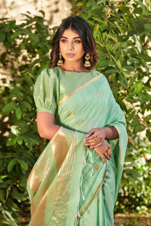 Pista green color soft linen saree with zari weaving butti