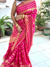 Rani pink color soft bandhej silk saree with zari weaving work