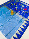 Sky blue color paithani silk saree with zari woven work