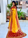 Yellow and maroon color soft bandhej silk saree with zari weaving work