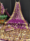 Purple color soft bandhej silk saree with zari weaving work